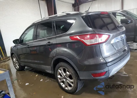 2015 Ford Escape Titanium z USA, uszkodzony, nr VIN 1FMCU9J9XFUA72274